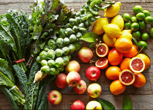 a group of fruits and vegetables on a wood surface Healthy Weight Loss Diets Uxbridge